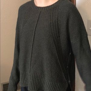 green sweater with cute button detail